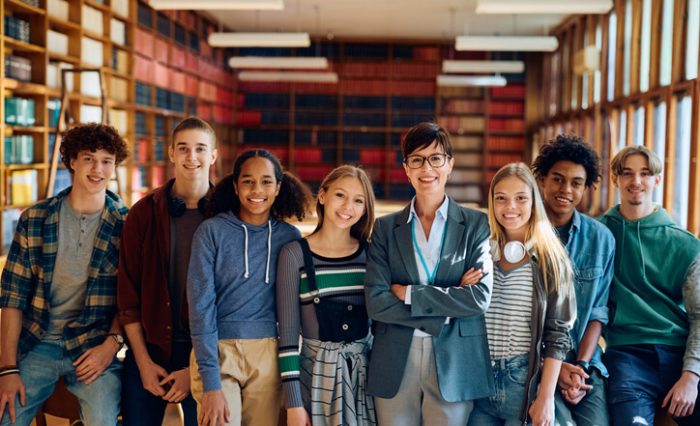 private school A group of smiling fast track university prep school students with an instructor