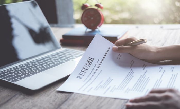 fast track university prep school A fast track university prep school student reviewing a resume at a desk