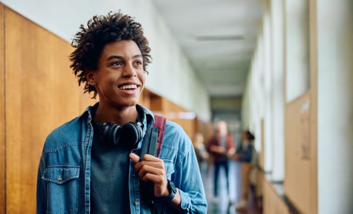 ESL program A smiling male student walking to his next class at our ESL school