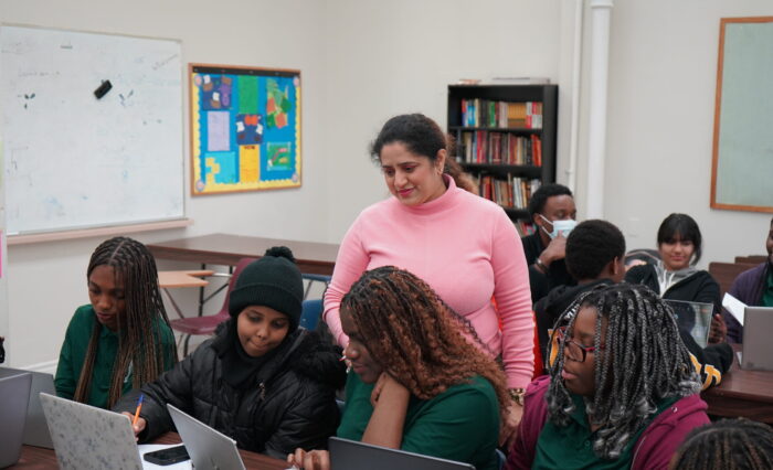 GLCT Classroom GLCT teacher guiding students through application forms.